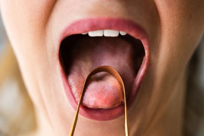 Ayurvedic Benefits Of Tongue Scraping And How To Do It